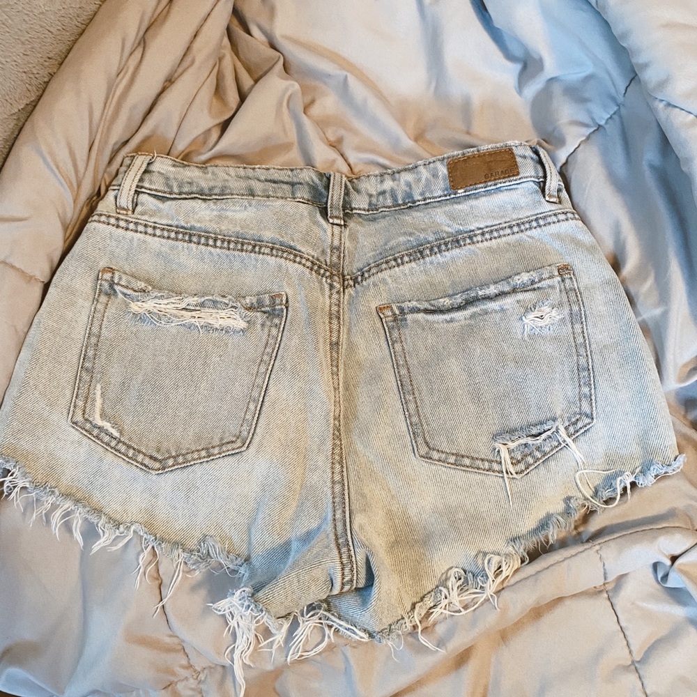 ripped garage jean shorts